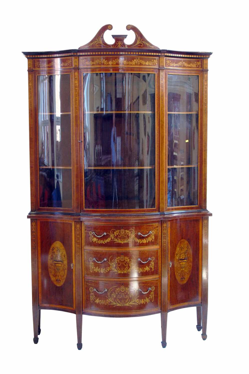 491 - Late 19th century serpentine front, glazed display cabinet by Edwards & Roberts.