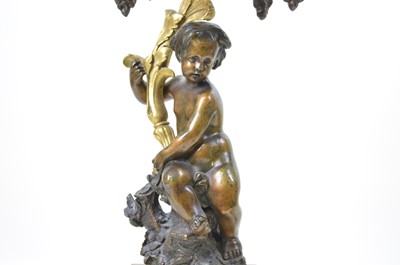 Lot 331 - A pair of early 20th-century bronze and ormolu mounted four branch candelabra