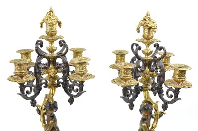 Lot 331 - A pair of early 20th-century bronze and ormolu mounted four branch candelabra