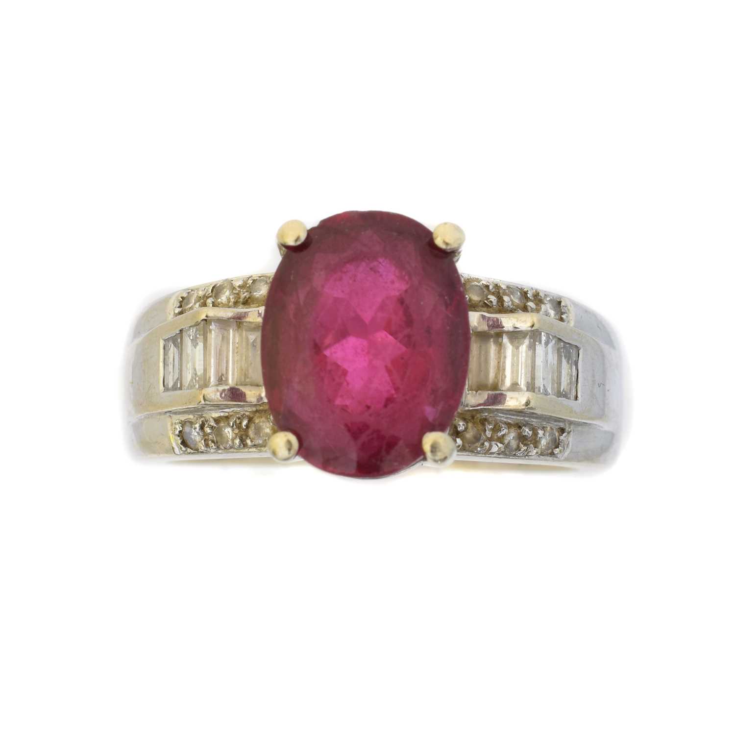 Lot 79 - A tourmaline and diamond dress ring