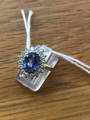 Lot 75 - An 18ct gold Sri Lankan sapphire and diamond cluster ring
