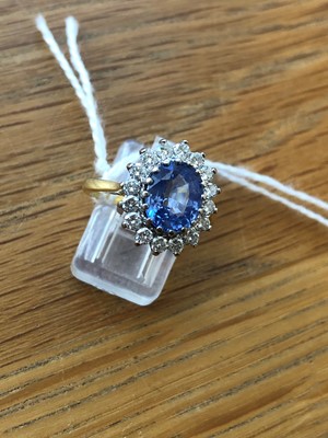Lot 75 - An 18ct gold Sri Lankan sapphire and diamond cluster ring