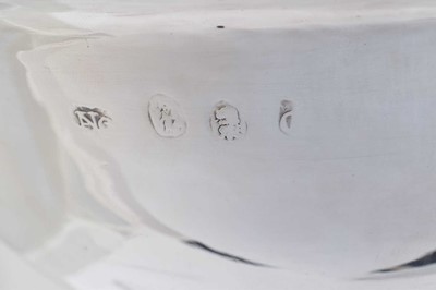 Lot 30 - A Queen Anne Britannia silver shaving bowl