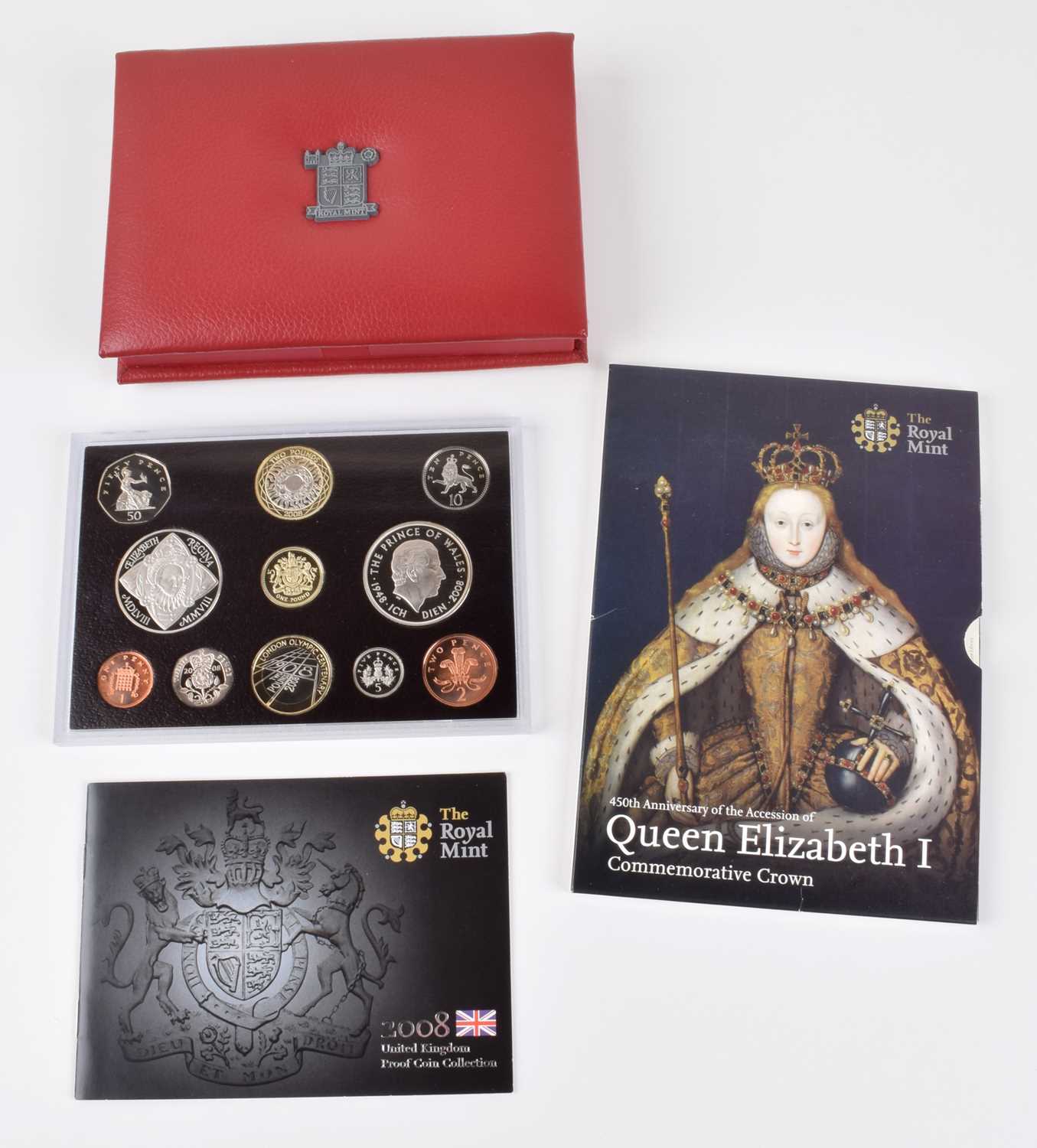 Lot 27 - Five Royal Mint Annual Proof Coin Collections and a Queen Elizabeth I Commemorative Crown (6).