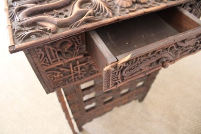 Lot 194 - A Late 19th/Early 20th Century Burmese Table with Folding Legs