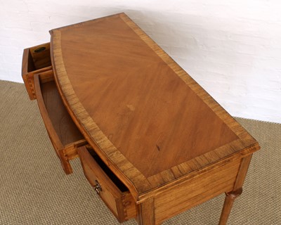 Lot 175 - A Walnut Bowfront Dressing Table, Mirror and Stool from the "Spire" Range by Frank Hudson Ltd.