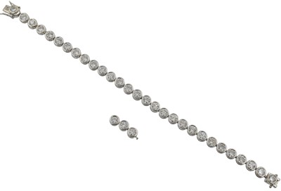 Lot 70 - A 10ct diamond tennis bracelet, set in 18ct gold