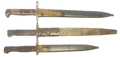 Lot 295 - Three bayonets and scabbards, to include a...