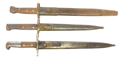 Lot 296 - Three bayonets and scabbards, to include a...