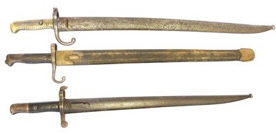 Lot 300 - Three bayonets and scabbards, to include a...