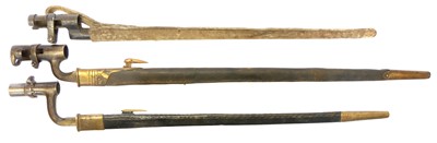 Lot 304 - Three socket bayonets and scabbards, to...