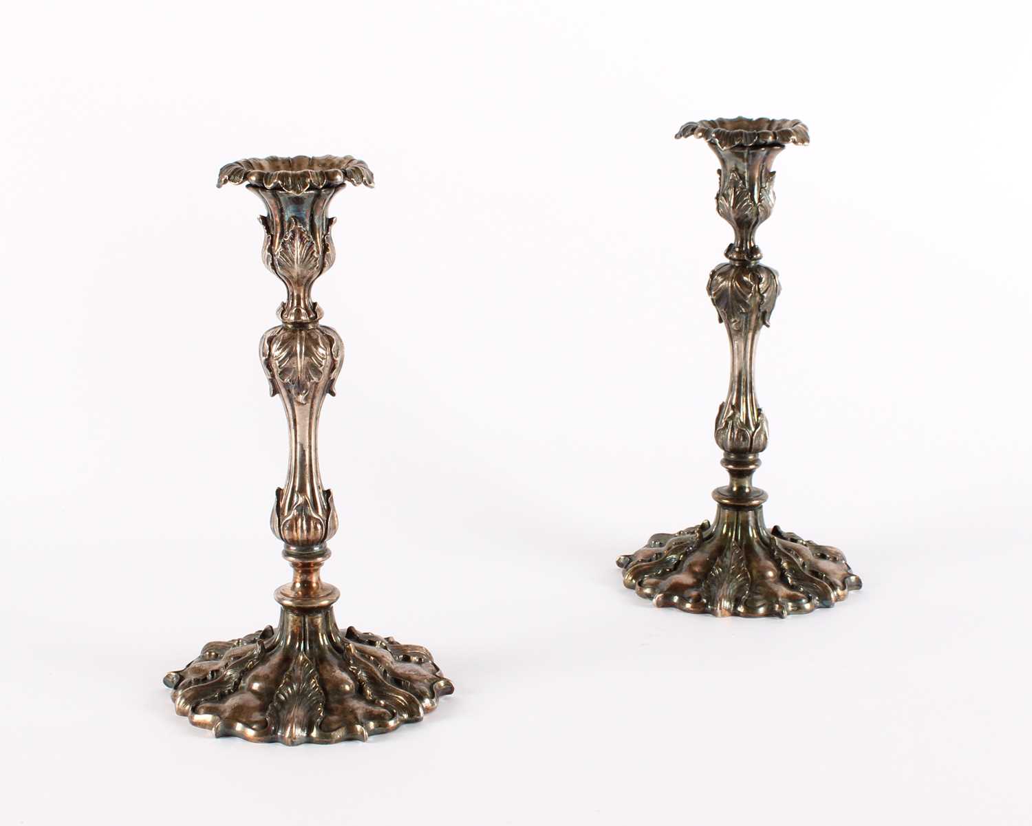 Lot A Pair of 19th Century 'Rococo Revival' Silver Plated Candlesticks