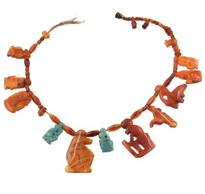 Lot 2 - An Egyptian revival carnelian and turquoise figurine bead necklace.