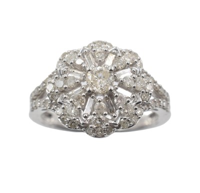 Lot 76 - A 10ct gold and diamond cluster ring