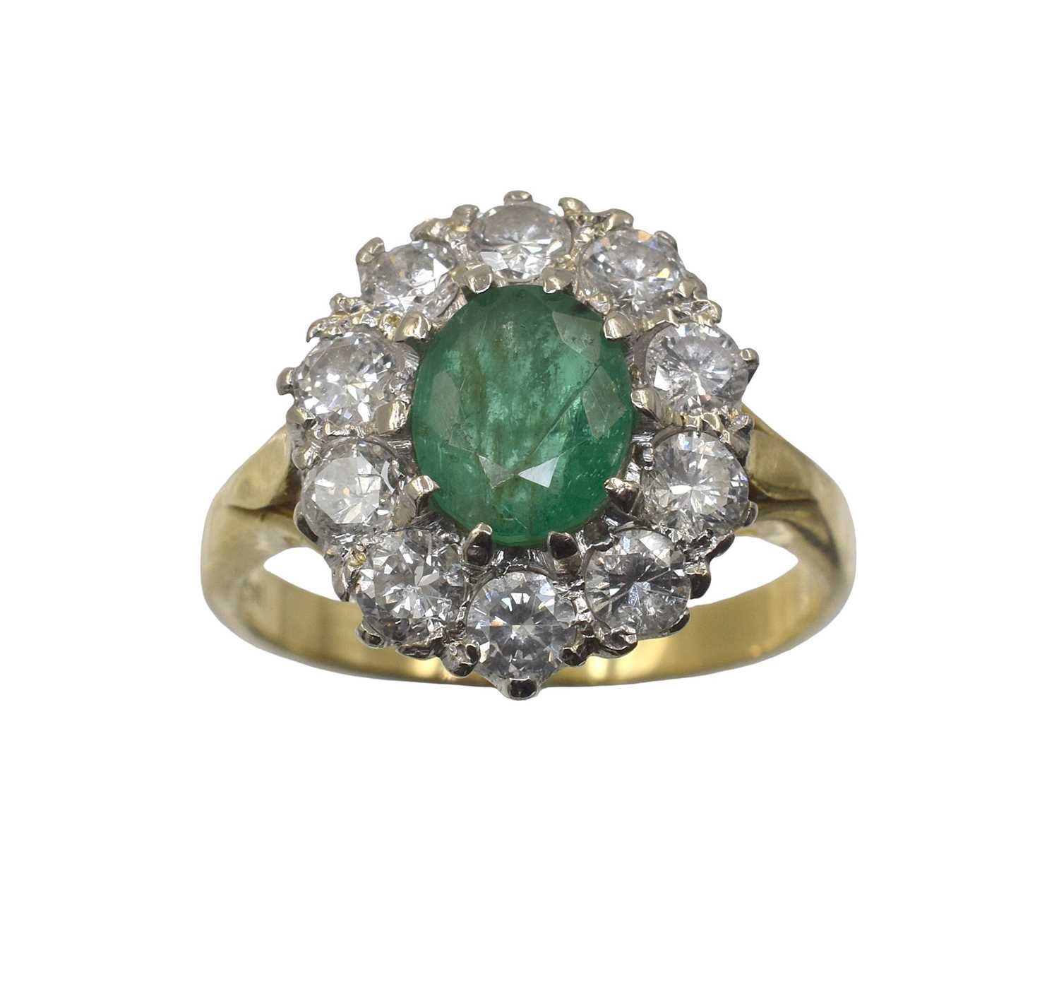 Lot 12 - An 18ct gold, emerald and diamond cluster ring