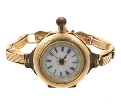 Lot 83 - A 9ct gold watch on an integral bracelet