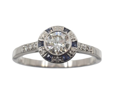 Lot 28 - An 18ct gold, sapphire and diamond ring