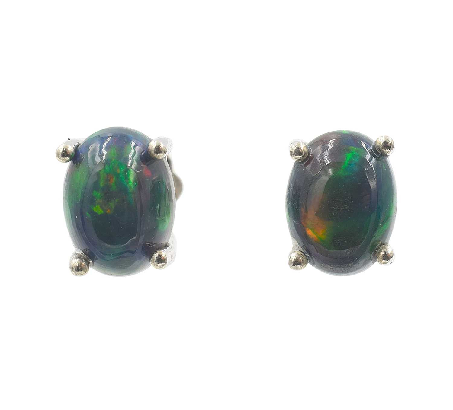 Lot 34 - A pair of oval cabochon black opal studs in silver