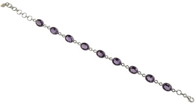 Lot 139 - A silver and amethyst line bracelet