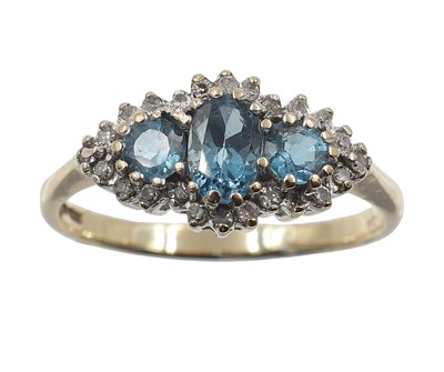 Lot 152 - A 9ct gold and blue topaz three stone ring