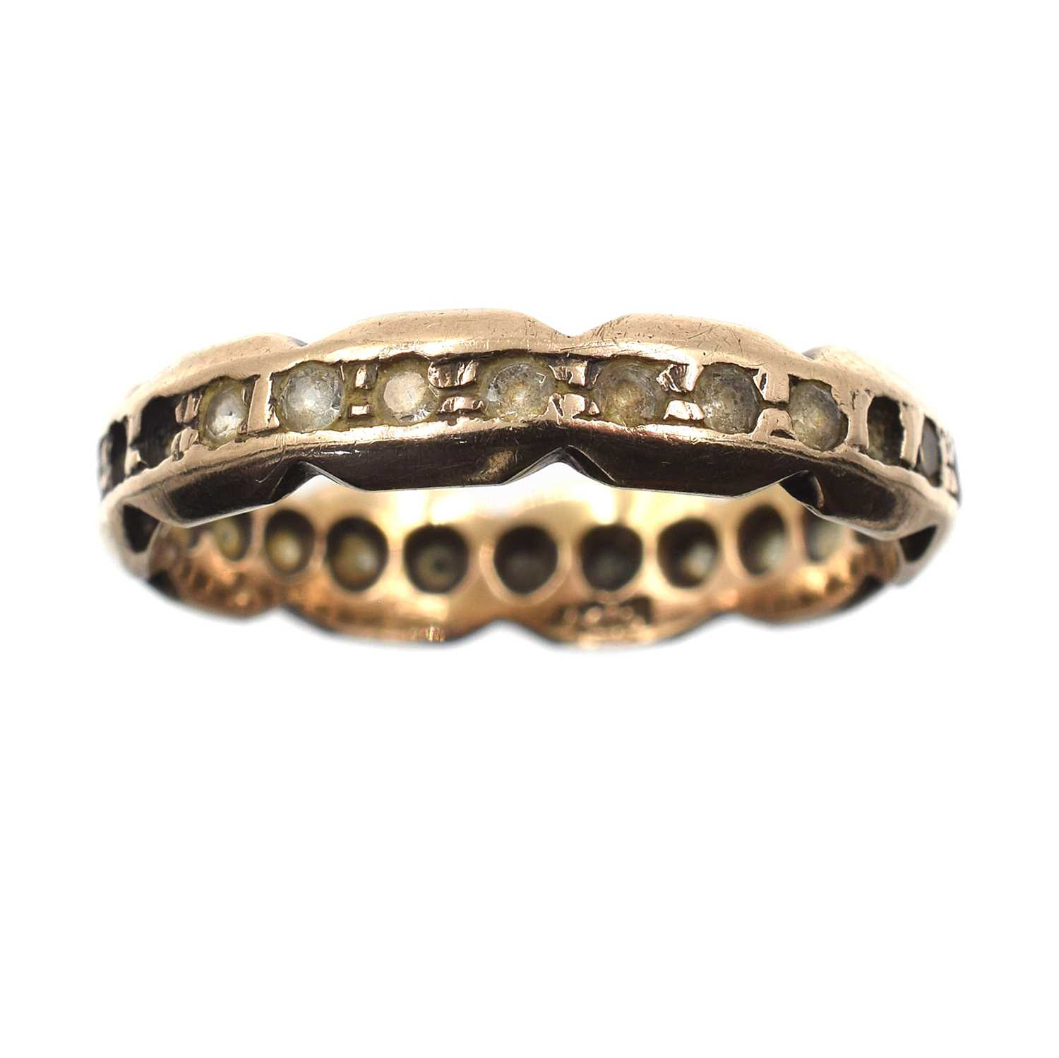 Lot 43 - A yellow metal eternity ring