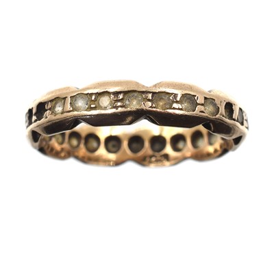 Lot 43 - A yellow metal eternity ring