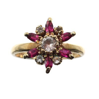 Lot 144 - A 9ct gold, ruby and white sapphire cluster ring