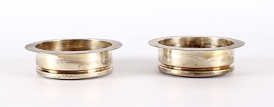 Lot 44 - A Pair of Elizabeth II Modernist Silver Mounted Bottle Coasters