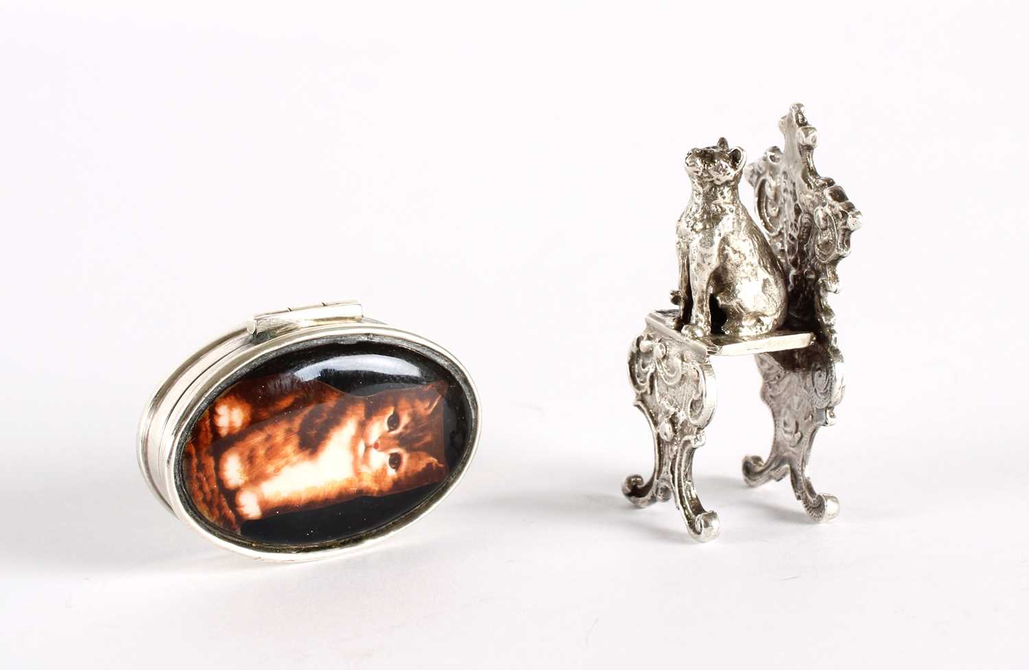 Lot 12 - An Elizabeth II Silver and Enamel Kitten Pill Box