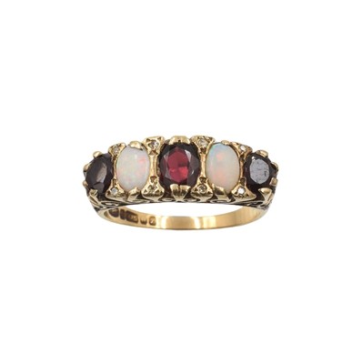 Lot A 9ct gold, garnet and opal boat ring