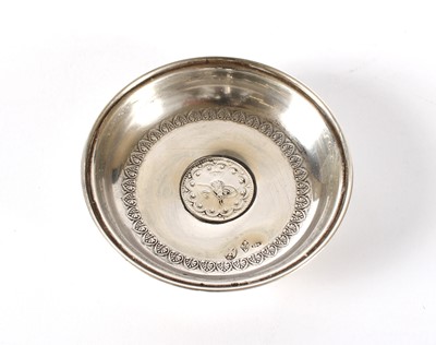 Lot 20 - An Eastern White Metal Coin Set Trinket Dish