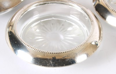 Lot 19 - A Set of Ten Early 20th Century American Sterling Silver Mounted Clear Glass Coasters