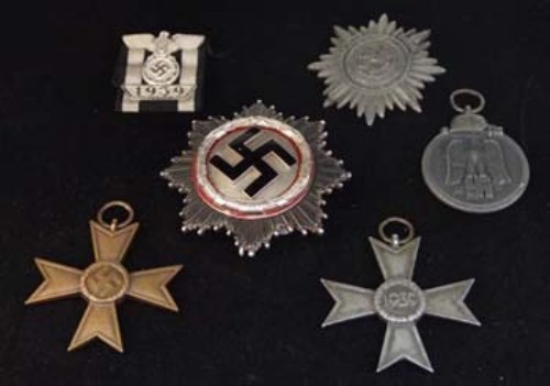 Lot 48 - A rare Second World War Nazi German Cross in silver and five other German medals (6).