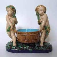 Lot 165 - Minton majolica cherubs sweet meat dish.
