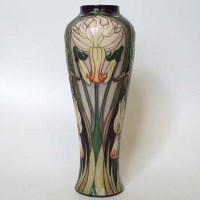 Lot 213 - Moorcroft march gold vase.