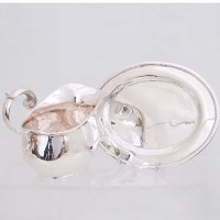 Lot 255 - Silver sauce boat and an oval stand (2)