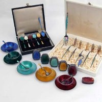 Lot 286 - Set of enamelled pepperettes, spoon set in case