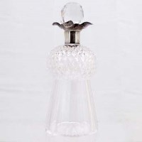 Lot 311 - Cut glass thistle shaped decanter with silver