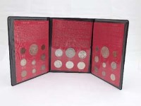 Lot 350 - Coin collection including 2 US silver Ellis Island and six credit Suisse silver ingots plus many commemorative coins cased sets and loose coins.
