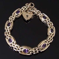 Lot 374 - 9ct gem set bracelet and locket