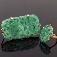Lot 384 - Carved jade brooch and ring.