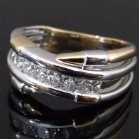 Lot 390 - 18ct gold bi-coloured half eternity ring