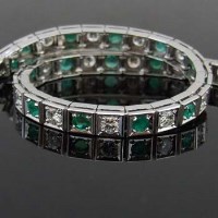Lot 408 - Emerald and diamond white gold tennis bracelet