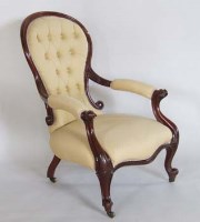 Lot 699 - Victorian mahogany spoon back easy chair