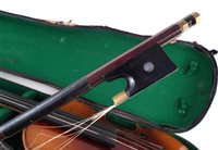 Lot 12 - Two cased violins and a cased trumpet and one other.